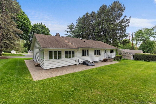 120 Peters Ln, Stratford, CT 06614 - rear view of property with a patio area, a chimney, a yard, and roof with shingles