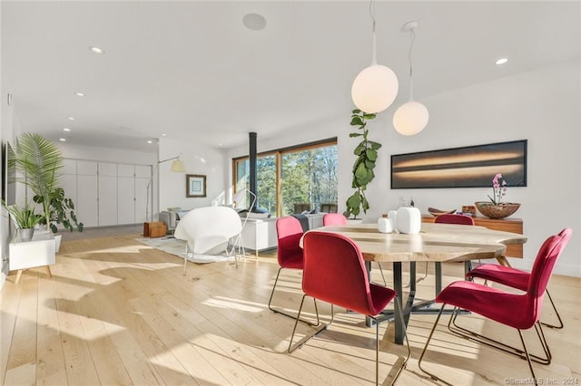 dining room featuring hardwood / wood-style flooring and recessed lighting