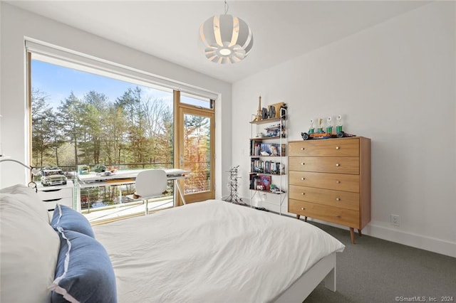 carpeted bedroom with baseboards