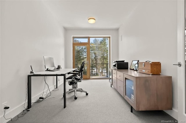 office with light colored carpet and baseboards