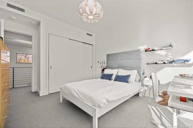 carpeted bedroom with a closet