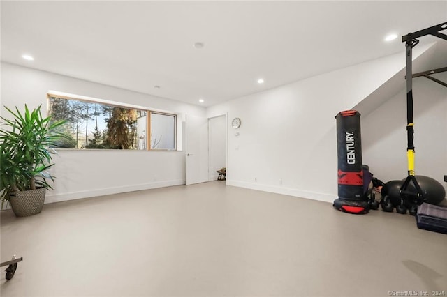 garage featuring recessed lighting and baseboards