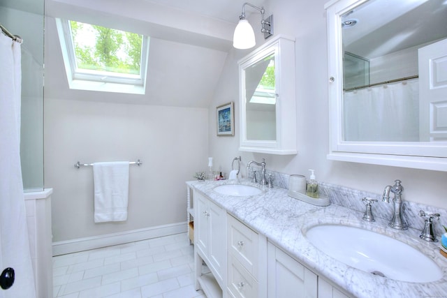 127 College Park Dr, Fairfield, CT 06824 - full bath with a skylight, tile patterned flooring, lofted ceiling, healthy amount of natural light, and double vanity