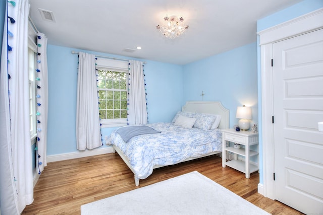 127 College Park Dr, Fairfield, CT 06824 - bedroom featuring wood finished floors, baseboards, a chandelier, and recessed lighting