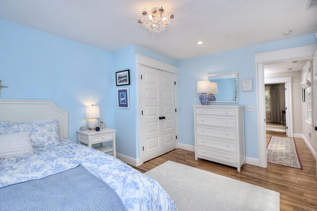 127 College Park Dr, Fairfield, CT 06824 - bedroom with wood finished floors, baseboards, a chandelier, and recessed lighting