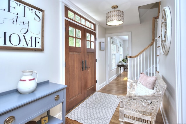 127 College Park Dr, Fairfield, CT 06824 - foyer with wood finished floors, stairs, and baseboards
