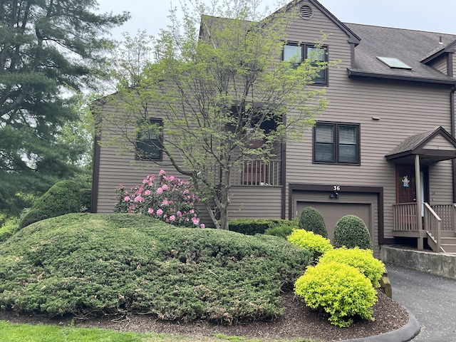 36 Overlook Dr Unit 36, Monroe, CT 06468 - view of home's exterior with an attached garage and roof with shingles
