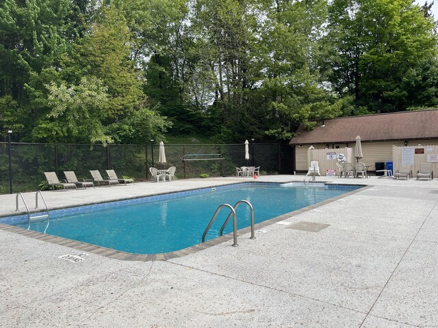 36 Overlook Dr Unit 36, Monroe, CT 06468 - community pool featuring fence, a patio area, and view of scattered trees