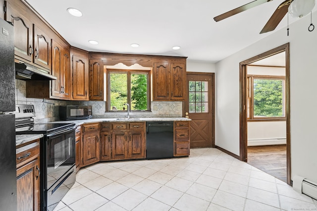 640 Cutspring Rd, Stratford, CT 06614 - kitchen featuring black appliances, under cabinet range hood, a baseboard heating unit, ceiling fan, and tasteful backsplash