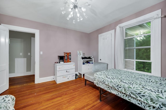 10 Fiske St, Waterbury, CT 06710 - bedroom with light wood-type flooring, a chandelier, baseboards, and a closet
