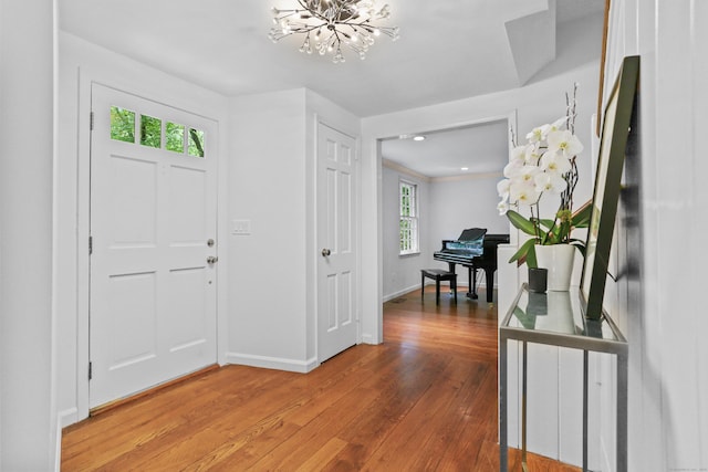 26 Heritage Ln, Weston, CT 06883 - foyer featuring a chandelier, light wood finished floors, and baseboards