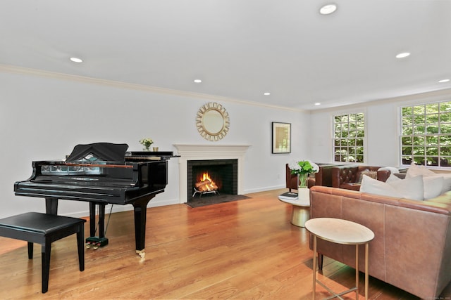 26 Heritage Ln, Weston, CT 06883 - living room featuring a brick fireplace, crown molding, recessed lighting, light wood-type flooring, and baseboards