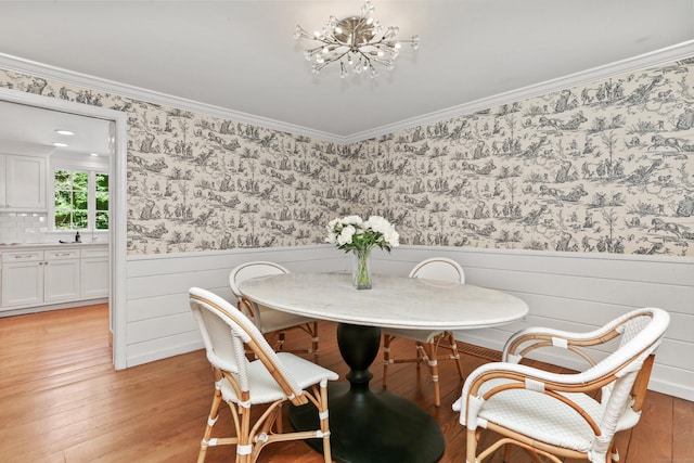 26 Heritage Ln, Weston, CT 06883 - dining area with a chandelier, light wood-type flooring, wallpapered walls, a wainscoted wall, and ornamental molding