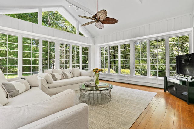 26 Heritage Ln, Weston, CT 06883 - sunroom / solarium with lofted ceiling, hardwood / wood-style floors, a baseboard radiator, rail lighting, and a deck