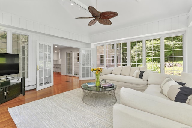 26 Heritage Ln, Weston, CT 06883 - sunroom / solarium featuring track lighting, vaulted ceiling, and french doors