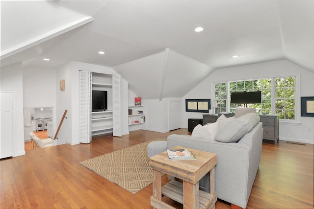 26 Heritage Ln, Weston, CT 06883 - living area with lofted ceiling, wood finished floors, recessed lighting, and baseboards