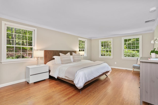 26 Heritage Ln, Weston, CT 06883 - bedroom featuring baseboards, light wood-style flooring, crown molding, and multiple windows