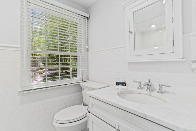 26 Heritage Ln, Weston, CT 06883 - half bath with tile walls, vanity, toilet, and wainscoting