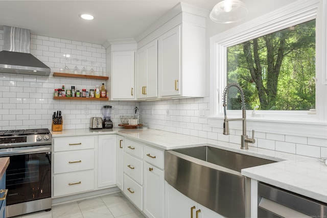 15 Haywardville Rd, East Haddam, CT 06423 - kitchen featuring wall chimney exhaust hood, stainless steel gas range, a sink, light marble finish floors, and tasteful backsplash