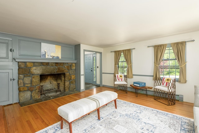 15 Haywardville Rd, East Haddam, CT 06423 - living room with wood finished floors, a baseboard heating unit, and a fireplace