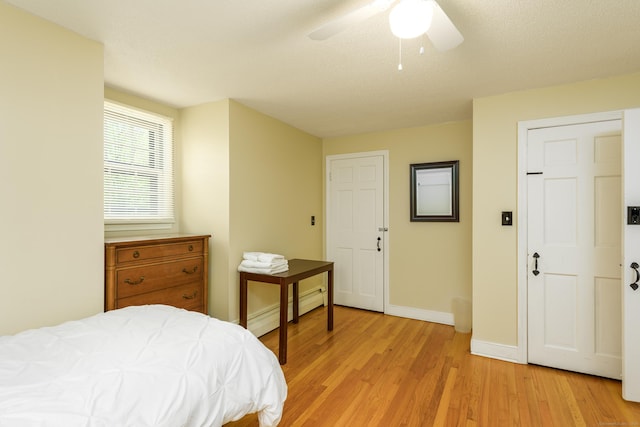 15 Haywardville Rd, East Haddam, CT 06423 - bedroom with light wood-style floors, baseboards, a baseboard radiator, and ceiling fan