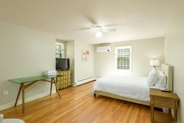 15 Haywardville Rd, East Haddam, CT 06423 - bedroom with a wall mounted air conditioner, wood finished floors, multiple windows, and baseboard heating