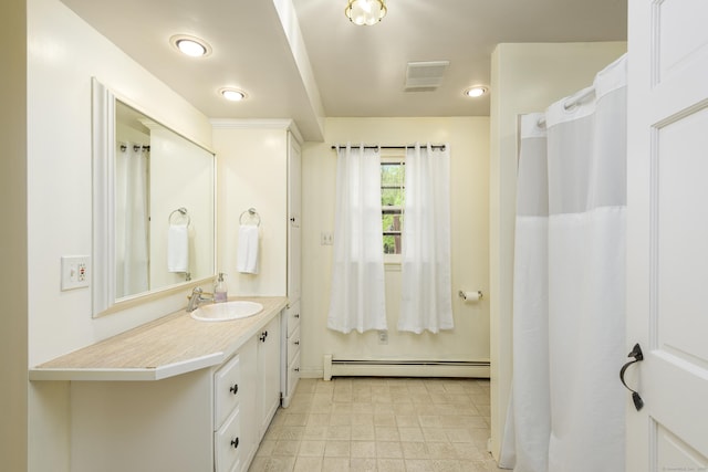 15 Haywardville Rd, East Haddam, CT 06423 - bathroom with a baseboard radiator, vanity, and baseboards