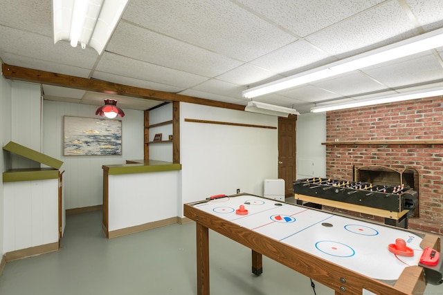 15 Haywardville Rd, East Haddam, CT 06423 - rec room with concrete flooring, baseboards, a fireplace, and a paneled ceiling