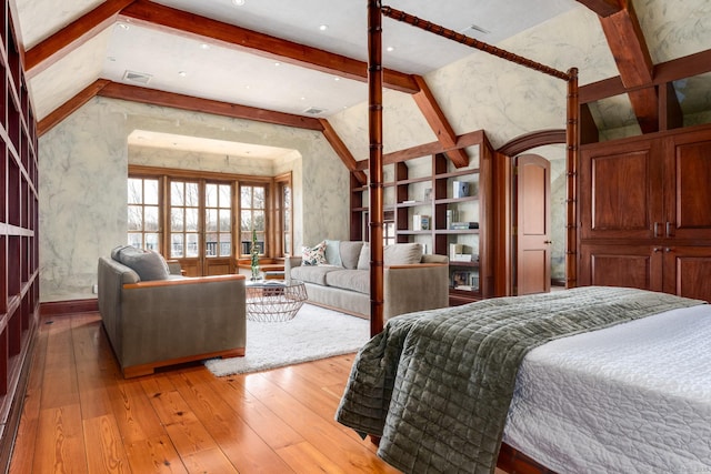 118 John St, Greenwich, CT 06831 - bedroom featuring light wood-style flooring, arched walkways, and baseboards