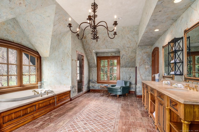 118 John St, Greenwich, CT 06831 - bathroom with a freestanding tub, vanity, a chandelier, recessed lighting, and baseboards