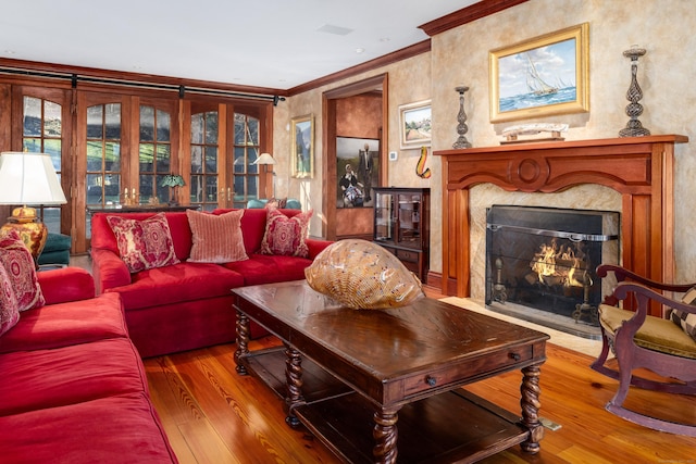 118 John St, Greenwich, CT 06831 - living area featuring crown molding, wood-type flooring, and a high end fireplace