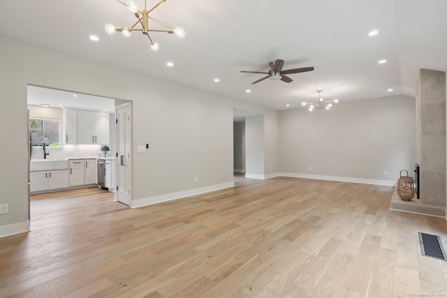 787 Heritage Vlg Unit A, Southbury, CT 06488 - unfurnished living room with a chandelier, recessed lighting, light wood finished floors, a ceiling fan, and a sink