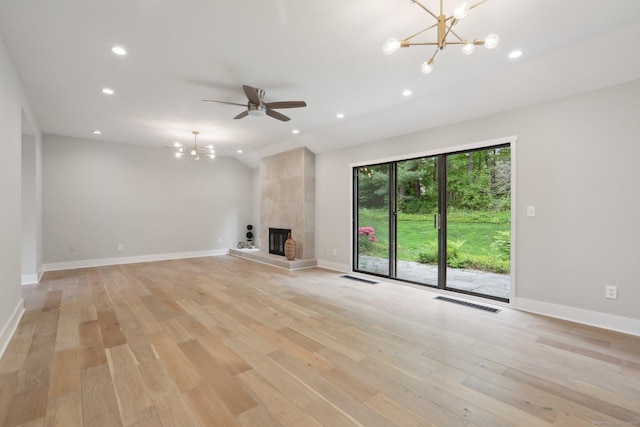 787 Heritage Vlg Unit A, Southbury, CT 06488 - unfurnished living room featuring a chandelier, light wood-type flooring, recessed lighting, baseboards, and a tile fireplace