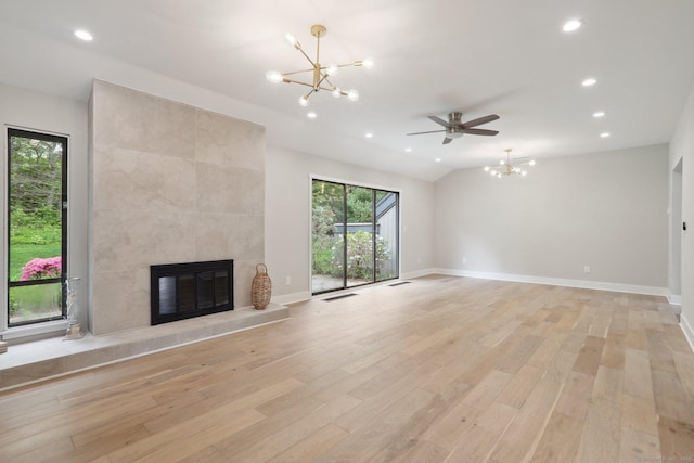 787 Heritage Vlg Unit A, Southbury, CT 06488 - unfurnished living room with a chandelier, light wood finished floors, recessed lighting, a tile fireplace, and baseboards