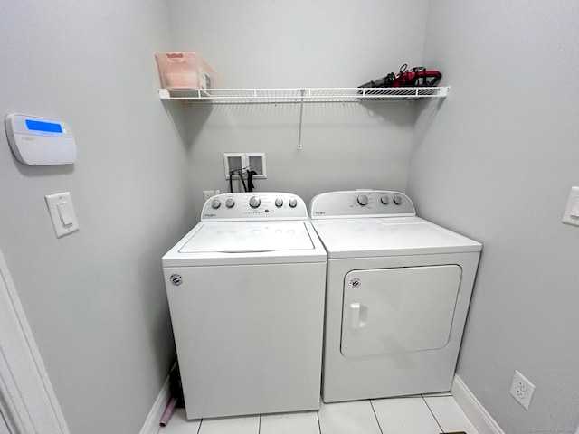 17 Highridge Rd Unit 17, Middlebury, CT 06762 - laundry area with separate washer and dryer, light tile patterned floors, and baseboards
