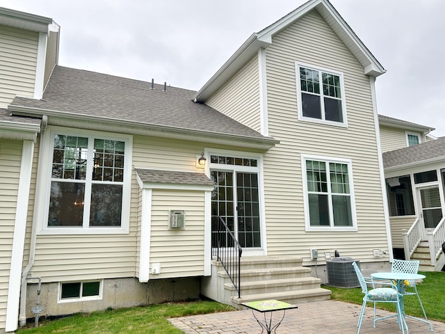 17 Highridge Rd Unit 17, Middlebury, CT 06762 - back of property with central AC unit, roof with shingles, a patio, and entry steps