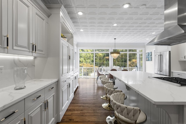122 Mirey Dam Rd, Middlebury, CT 06762 - kitchen featuring high quality fridge, wall chimney range hood, a kitchen bar, an ornate ceiling, and recessed lighting