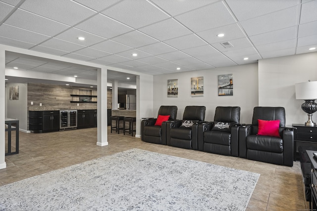 122 Mirey Dam Rd, Middlebury, CT 06762 - cinema room featuring beverage cooler, bar, tile patterned flooring, recessed lighting, and a drop ceiling