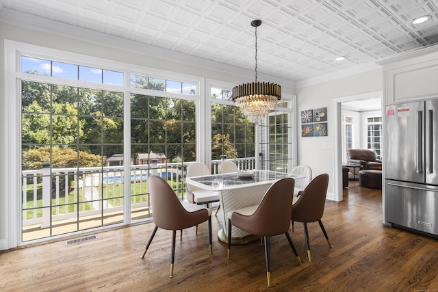 122 Mirey Dam Rd, Middlebury, CT 06762 - dining area featuring dark wood-style floors, a chandelier, ornamental molding, an ornate ceiling, and baseboards