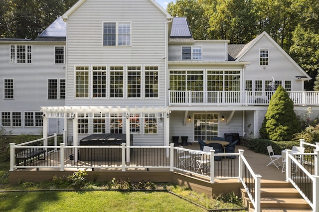 122 Mirey Dam Rd, Middlebury, CT 06762 - back of property with a pergola, a deck, a hot tub, and a sunroom