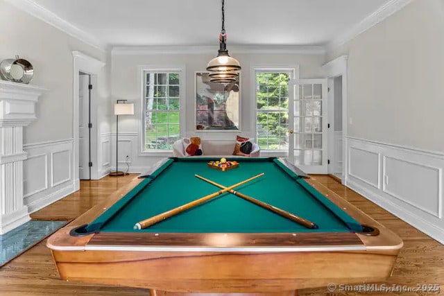 122 Mirey Dam Rd, Middlebury, CT 06762 - rec room with billiards table, a decorative wall, wood finished floors, crown molding, and a wainscoted wall