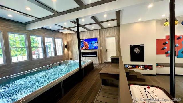122 Mirey Dam Rd, Middlebury, CT 06762 - game room featuring coffered ceiling, recessed lighting, beamed ceiling, and wood finished floors
