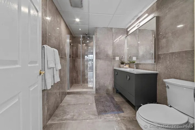 122 Mirey Dam Rd, Middlebury, CT 06762 - full bathroom featuring tile walls, vanity, toilet, and a shower stall