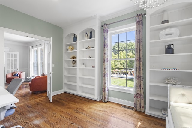 122 Mirey Dam Rd, Middlebury, CT 06762 - home office with ornamental molding, baseboards, wood finished floors, and healthy amount of natural light
