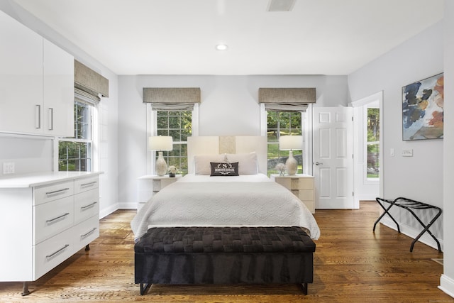 122 Mirey Dam Rd, Middlebury, CT 06762 - bedroom with multiple windows, wood finished floors, baseboards, and recessed lighting
