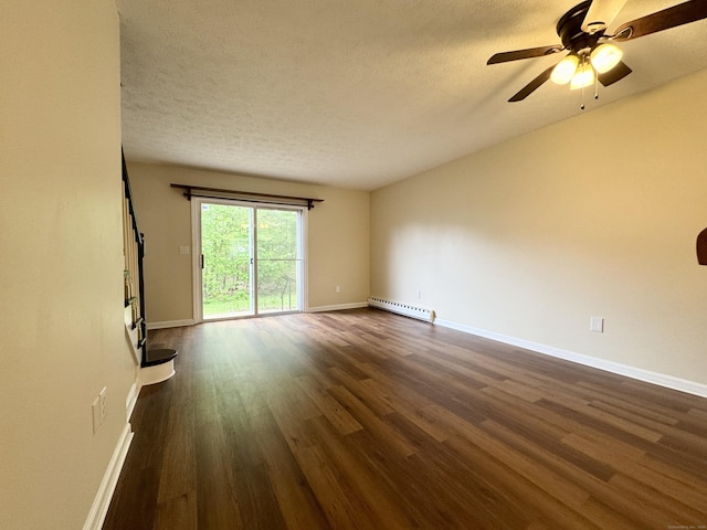 spare room featuring a baseboard radiator, dark wood-style floors, baseboards, a ceiling fan, and a textured ceiling