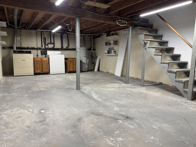 unfinished basement with electric water heater, washing machine and dryer, and stairway