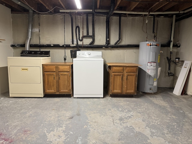 unfinished below grade area with electric water heater and independent washer and dryer