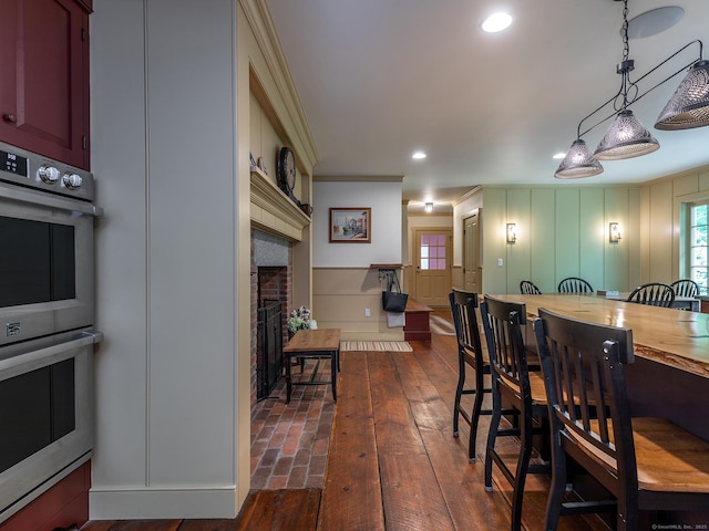 332 Good Hill Rd, Woodbury, CT 06798 - dining room with a brick fireplace, ornamental molding, recessed lighting, and a decorative wall
