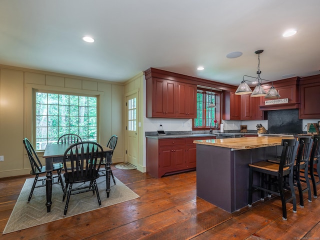 332 Good Hill Rd, Woodbury, CT 06798 - kitchen featuring dark wood-type flooring, a kitchen island, pendant lighting, a kitchen bar, and recessed lighting